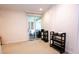 Bright sunroom with sliding glass doors to the outside, complete with shelving units at 2734 Peachtree Nw Rd # C-404, Atlanta, GA 30305