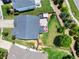 Aerial view of a home with an outdoor entertainment area and green, fenced backyard at 5730 Arbor Green Cir, Sugar Hill, GA 30518