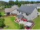 Spacious backyard with a patio seating area, a section with a pergola and a fenced yard at 5730 Arbor Green Cir, Sugar Hill, GA 30518