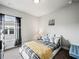 Cozy bedroom featuring neutral tones and a view from the window at 5730 Arbor Green Cir, Sugar Hill, GA 30518