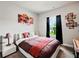Bedroom featuring neutral tones, view from window, and art on the wall at 5730 Arbor Green Cir, Sugar Hill, GA 30518