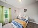 Cozy bedroom featuring carpeted floors, a comfortable bed, and serene natural light at 5730 Arbor Green Cir, Sugar Hill, GA 30518