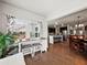 Charming breakfast nook next to the kitchen with a desk, a table, stools, and bright light from the windows at 5730 Arbor Green Cir, Sugar Hill, GA 30518