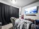 Entertainment room features a large TV, comfortable seating, and movie decor at 5730 Arbor Green Cir, Sugar Hill, GA 30518