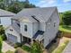 Side view of a lovely two-story home with a well-maintained lawn and mature landscaping at 5730 Arbor Green Cir, Sugar Hill, GA 30518