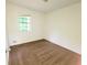 Neutral bedroom with carpet and a window providing natural light at 1225 Creek Forest Nw Ct, Conyers, GA 30012