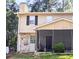 Two-story home with a screened-in porch and stone accents at 1225 Creek Forest Nw Ct, Conyers, GA 30012