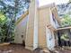 Exterior shot of a two story home showing the chimney and siding at 1225 Creek Forest Nw Ct, Conyers, GA 30012