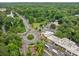 Aerial view of a neighborhood roundabout surrounded by lush greenery and commercial buildings at 1478 Oxford Ne Rd, Atlanta, GA 30307