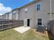 Cozy backyard with a small grass area, concrete patio, and wood fence offering privacy and outdoor space at 1942 Dillon Dr, Lithonia, GA 30058