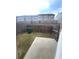 Fenced backyard with a small patio, offering privacy and outdoor space at 1942 Dillon Dr, Lithonia, GA 30058