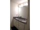 Bathroom vanity with granite countertop and dual sinks at 1942 Dillon Dr, Lithonia, GA 30058