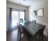 Cozy dining area with a modern table, comfortable chairs, and natural light from the door at 1942 Dillon Dr, Lithonia, GA 30058