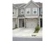 Inviting townhome with stone accents, neutral siding, and a convenient two-car garage at 1942 Dillon Dr, Lithonia, GA 30058