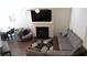 Well-lit living area with modern furniture, a fireplace, and a wall-mounted TV at 1942 Dillon Dr, Lithonia, GA 30058