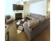 Comfortable living room with a fireplace, modern decor, and a large sectional sofa at 1942 Dillon Dr, Lithonia, GA 30058