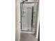 Contemporary walk-in shower with modern fixtures, shelving, and pristine design at 1942 Dillon Dr, Lithonia, GA 30058