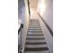 A modern staircase with white risers and dark treads leads to the upper level at 1942 Dillon Dr, Lithonia, GA 30058