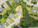 Aerial view showcases the house and backyard wooded area in a serene neighborhood cul-de-sac, approximate property lines are outlined at 2605 Fort Apachee Trl, Dacula, GA 30019
