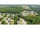 Aerial view showcases the neighborhood's lush greenery and community layout, highlighting the home's location at 2605 Fort Apachee Trl, Dacula, GA 30019