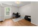 Bedroom with hardwood floors and natural light, and closet system at 2605 Fort Apachee Trl, Dacula, GA 30019
