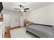 Bright bedroom with ceiling fan, closet, and plenty of light at 2605 Fort Apachee Trl, Dacula, GA 30019