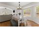 Dining area with bright windows and views of the connecting rooms, allowing for seamless flow at 2605 Fort Apachee Trl, Dacula, GA 30019