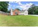 Charming single-story home featuring a brick facade, white siding, and a well-manicured lawn at 2605 Fort Apachee Trl, Dacula, GA 30019