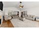 Spacious living room featuring hardwood floors, neutral decor, and an open layout at 2605 Fort Apachee Trl, Dacula, GA 30019