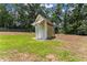 Backyard shed on a grassy lot at 2605 Fort Apachee Trl, Dacula, GA 30019