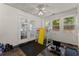 Bright sunroom with windows, ceiling fan, and exercise equipment at 2605 Fort Apachee Trl, Dacula, GA 30019