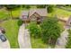 Charming two-story home with a well-maintained front yard, long driveway, and inviting red front door at 2870 Tattersall Ct, Cumming, GA 30041