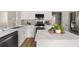 Well-equipped kitchen with stainless steel appliances, quartz countertops, and white cabinets with sleek hardware at 2870 Tattersall Ct, Cumming, GA 30041
