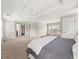 Spacious main bedroom with a tray ceiling, carpet, and access to the bathroom and walk-in closet at 2870 Tattersall Ct, Cumming, GA 30041