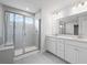 Modern bathroom featuring double sinks, glass shower, and tile flooring at 120 Aj Welch Jr Way, Mcdonough, GA 30252