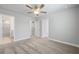 Inviting bedroom with plush carpeting, ceiling fan, and ensuite bathroom access at 120 Aj Welch Jr Way, Mcdonough, GA 30252
