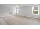 Bright bedroom with carpet, a ceiling fan, and access to an attached bathroom at 120 Aj Welch Jr Way, Mcdonough, GA 30252