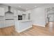 Modern kitchen with white cabinets, stainless steel appliances, and a center island with countertop seating at 120 Aj Welch Jr Way, Mcdonough, GA 30252