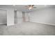 Spacious loft area with neutral carpeting, ceiling fan, and natural light at 120 Aj Welch Jr Way, Mcdonough, GA 30252