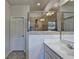 Tiled shower with glass door, and dual-sink vanity in a modern and stylish bathroom at 3360 Pickens St, Duluth, GA 30096