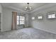 Spacious bedroom features three large windows and plush carpeting at 3360 Pickens St, Duluth, GA 30096