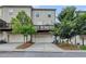 View of townhome featuring garage parking and a private deck at 3360 Pickens St, Duluth, GA 30096