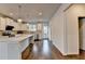 Kitchen with stainless steel appliances, white cabinets, granite counters, and wood floors at 3360 Pickens St, Duluth, GA 30096