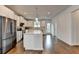 Kitchen with stainless steel appliances, white cabinets, and a large center island at 3360 Pickens St, Duluth, GA 30096