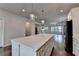 Modern kitchen features a large white center island, stainless steel appliances, and hardwood floors at 3360 Pickens St, Duluth, GA 30096
