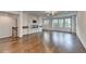 Living room with fireplace, hardwood floors, and large windows to let in natural light at 3360 Pickens St, Duluth, GA 30096