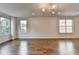 Bright living room with hardwood floors, recessed lights and plenty of natural light from the windows at 3360 Pickens St, Duluth, GA 30096