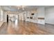 Open concept living space with modern lighting, fireplace and easy access to the kitchen area at 3360 Pickens St, Duluth, GA 30096