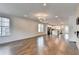 Bright living space with hardwood floors, a fireplace, modern lighting, and open kitchen access at 3360 Pickens St, Duluth, GA 30096