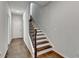 Elegant staircase with wooden treads, iron railing, and a contrasting white riser create a striking focal point at 3360 Pickens St, Duluth, GA 30096